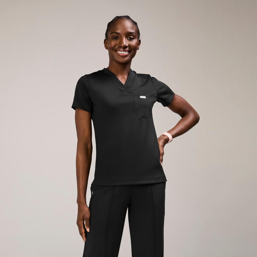 Model wearing black medical scrubs